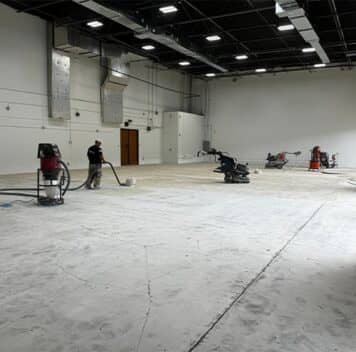 multiple gentleman repairing concrete for commercial property