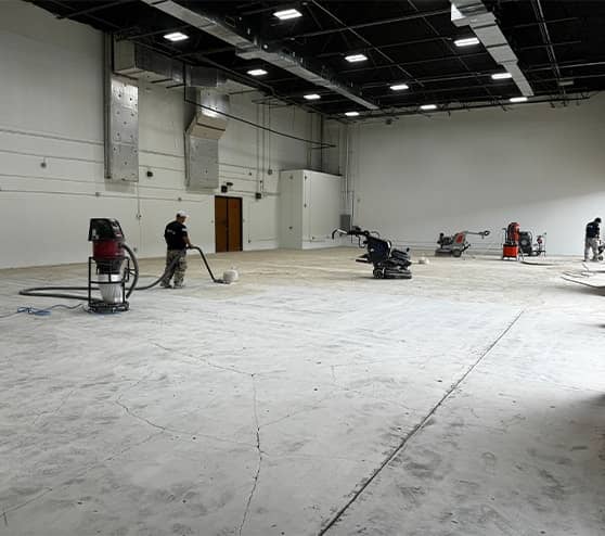 multiple gentleman repairing concrete for commercial property