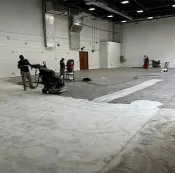 multiple guys repairing concrete