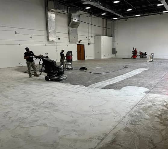 multiple guys repairing concrete