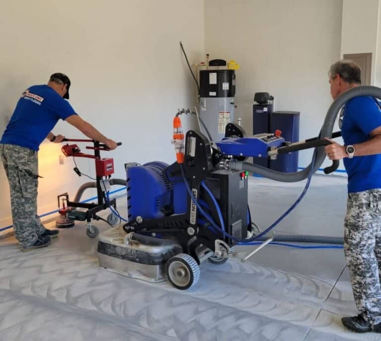 MACH ONE® employees grinding flooring