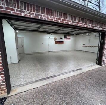 homeowner garage with new epoxy flooring installed