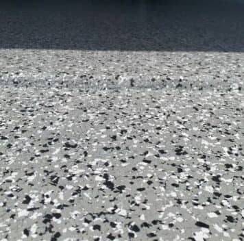 close-up of grey epoxy flake flooring for mirela