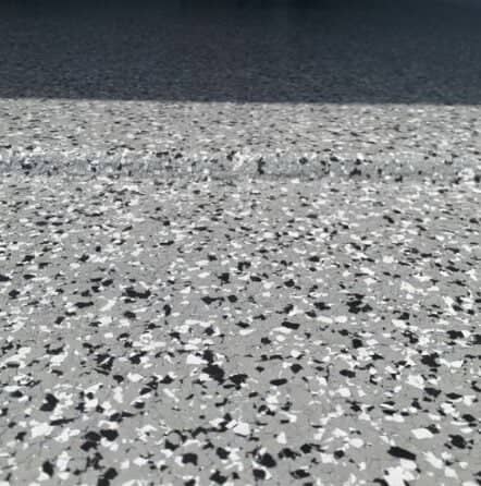 close-up of grey epoxy flake flooring for mirela