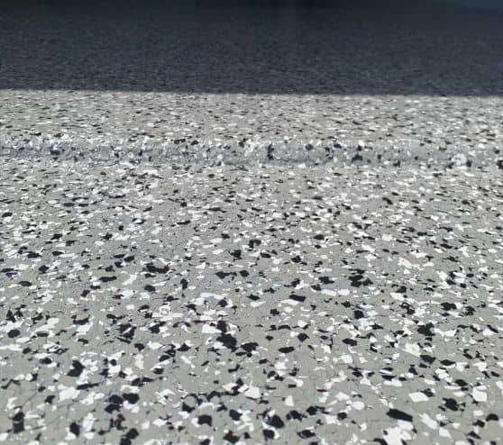 close-up of grey epoxy flake flooring for mirela