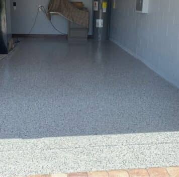 mirela garage with new epoxy flake flooring installed
