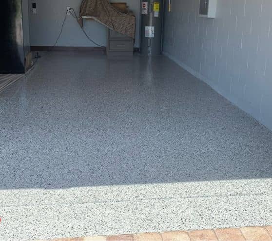 mirela garage with new epoxy flake flooring installed