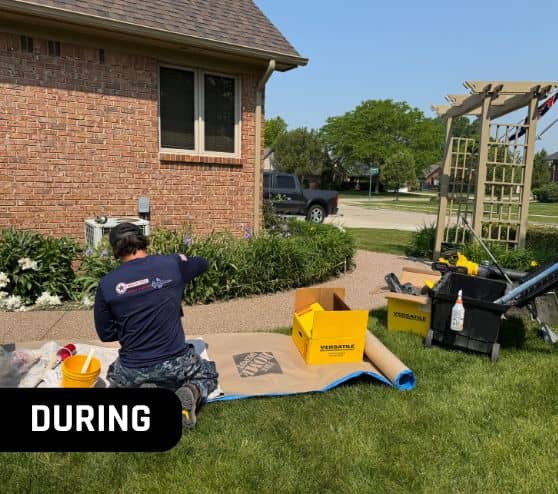 MACH ONE® employees installing epoxy flooring for homeowner side walk