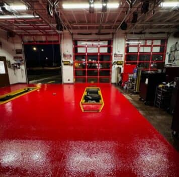 front view of Take 5 Oil Change garage with new red epoxy flake flooring