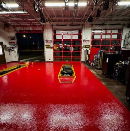 front view of Take 5 Oil Change garage with new red epoxy flake flooring