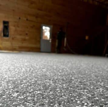 close-up of Stoney Creek Epoxy Flake Flooring for homeowner barn