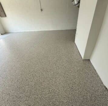 homeowner garage with new epoxy flake flooring installed