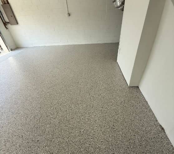 homeowner garage with new epoxy flake flooring installed