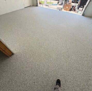 homeowner two car garage with new epoxy flake flooring installed
