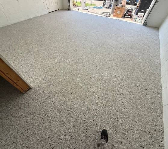 homeowner two car garage with new epoxy flake flooring installed