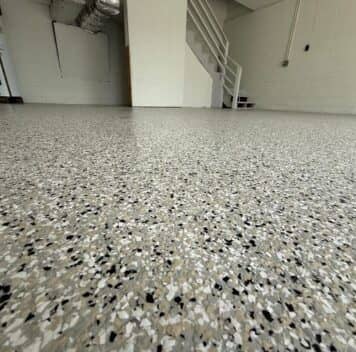 close-up of cabin fever epoxy flake flooring installed for homeowner garage