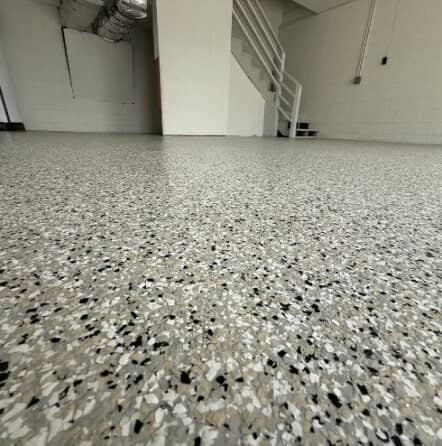 close-up of cabin fever epoxy flake flooring installed for homeowner garage