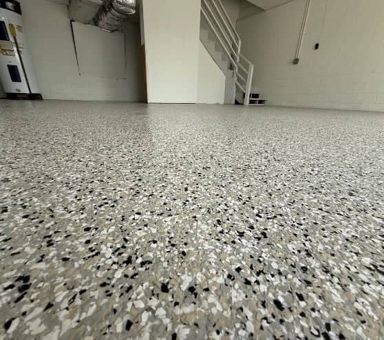 close-up of cabin fever epoxy flake flooring installed for homeowner garage