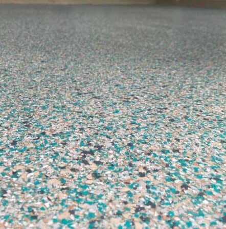 close-up of custom epoxy flake flooring for homeowner