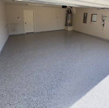 homeowner garage with new epoxy flake flooring installed