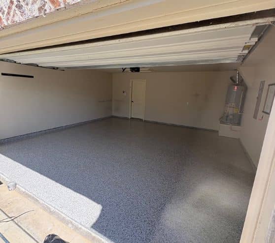 side view of homeowner garage with new dakota grey epoxy flake flooring installed