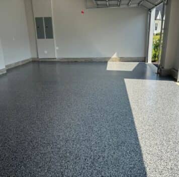 homeowner garage with new epoxy flake flooring installed