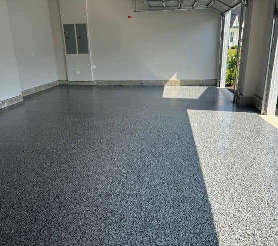 homeowner garage with new epoxy flake flooring installed