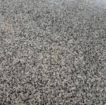 close-up of epoxy flake flooring freshly installed for homeowner garage