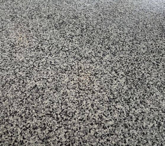 close-up of epoxy flake flooring freshly installed for homeowner garage
