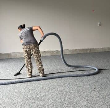 MACH ONE® employee installing new epoxy flake flooring