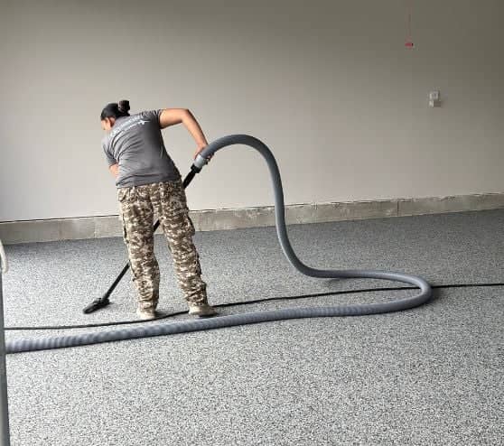 MACH ONE® employee installing new epoxy flake flooring