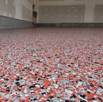 close-up of red epoxy flake flooring for homeowner