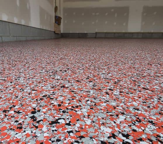 close-up of red epoxy flake flooring for homeowner