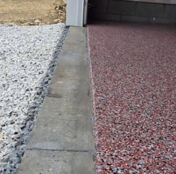 close-up of red epoxy flake flooring for homeowner garage