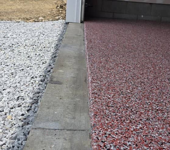 close-up of red epoxy flake flooring for homeowner garage