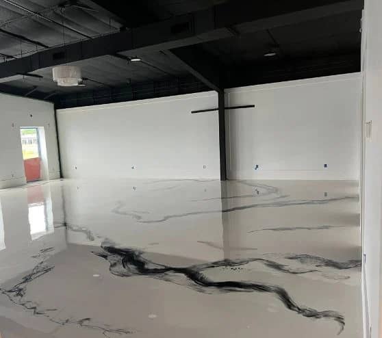 close-up of solid epoxy flooring installed for Boutique Owner