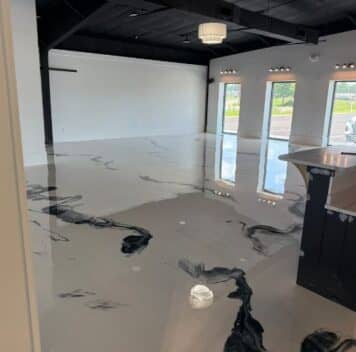 Boutique Owner store with freshly installed solid epoxy flooring