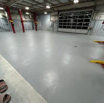 after portrait of Gullo Toyota and Mazda garage with new solid epoxy flooring