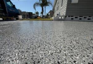 epoxy installation on driveway in summer sun