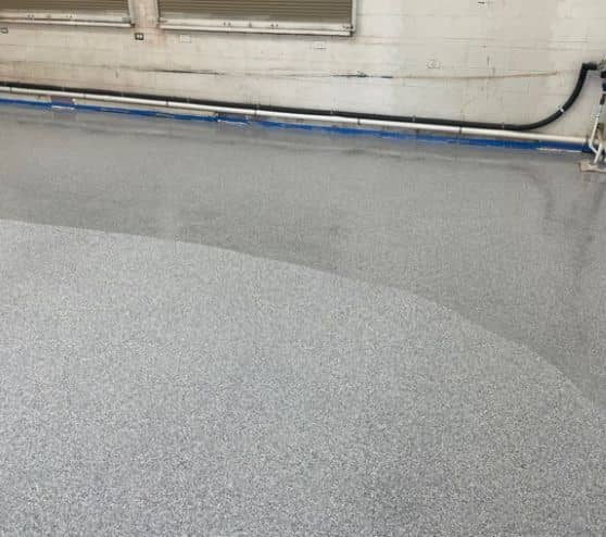 close-up epoxy flooring freshly poured for James​ ​McKnight​ ​Park concession stand