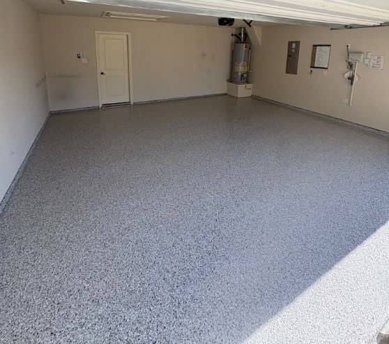 homeowner garage with new epoxy flake flooring installed