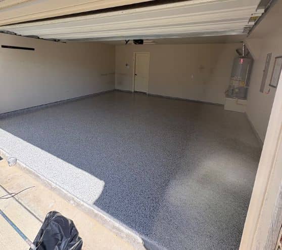 side view of homeowner garage with new dakota grey epoxy flake flooring installed