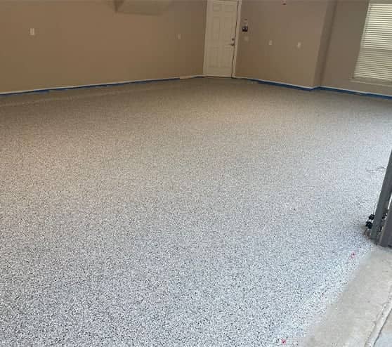 freshly poured epoxy flake flooring for homeowner