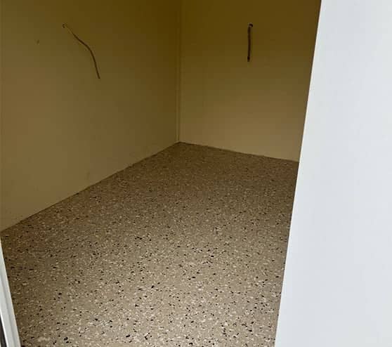 storage shed with new epoxy flake flooring
