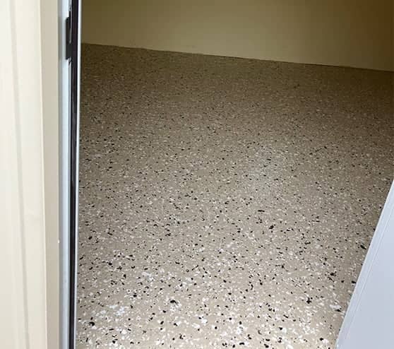 homeowner storage shed with new epoxy flake flooring