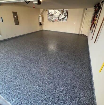 homeowner garage with new epoxy flooring installed