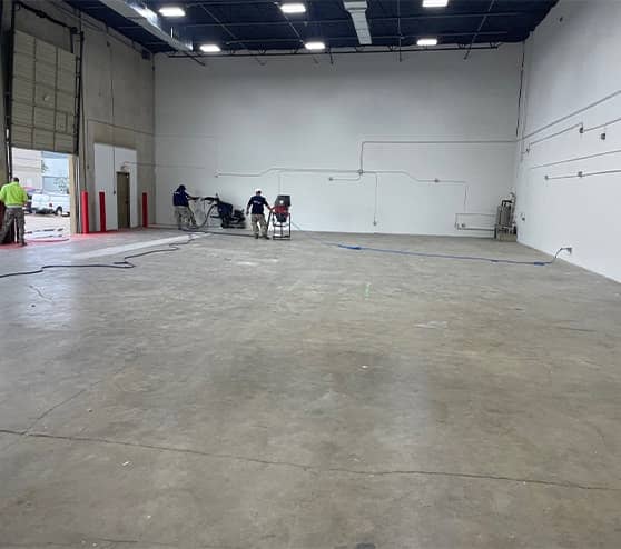 employees working on LLumar Window and Paint Protection Film new flooring