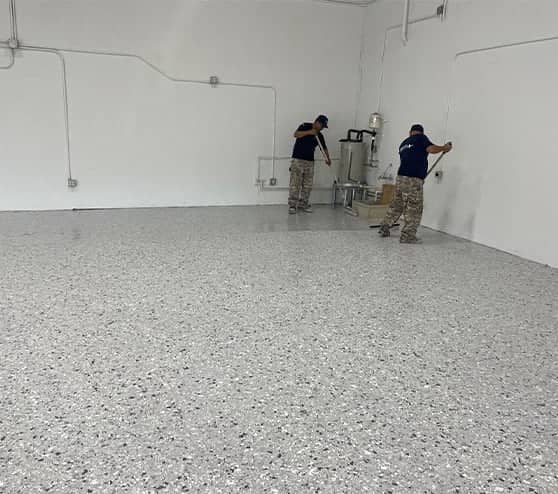 two employees working on LLumar Window and Paint Protection Film flooring