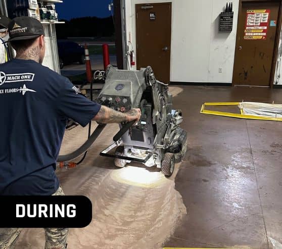 MACH ONE® employee installing new epoxy flooring for Take 5 Oil Change