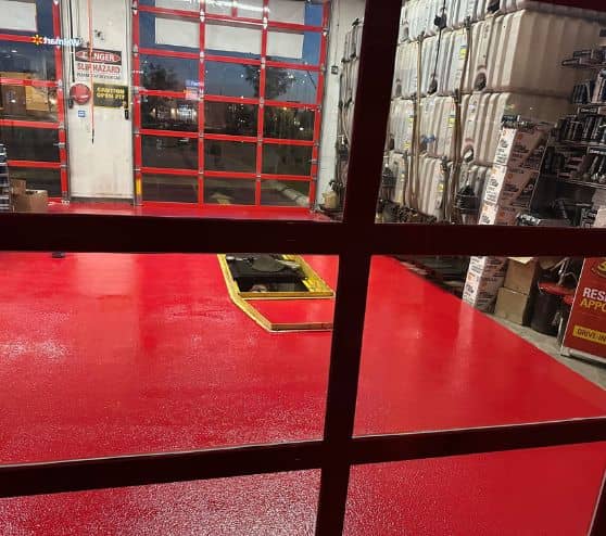 red epoxy flake flooring installed for Take 5 Oil Change garage